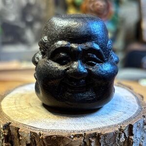 Faces of Buddha black wooden sculpture